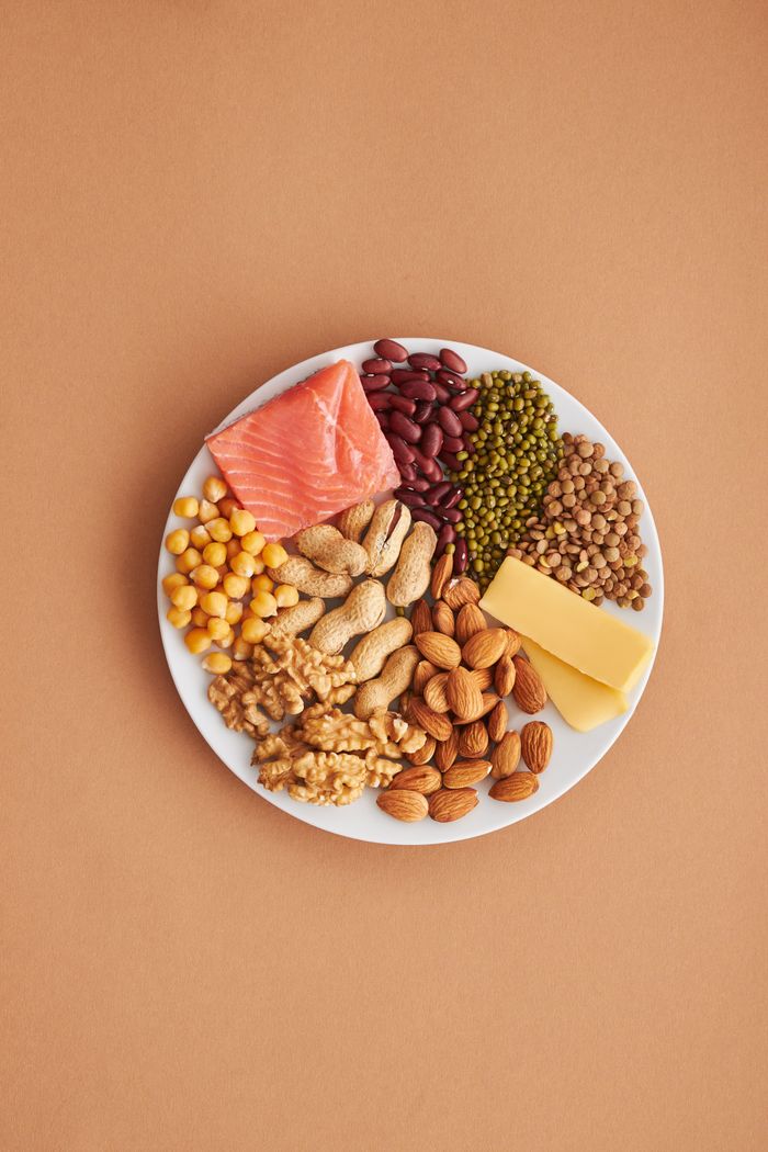 about-us-02 Colorful assortment of proteins and legumes on a white plate, perfect for healthy eating inspiration.